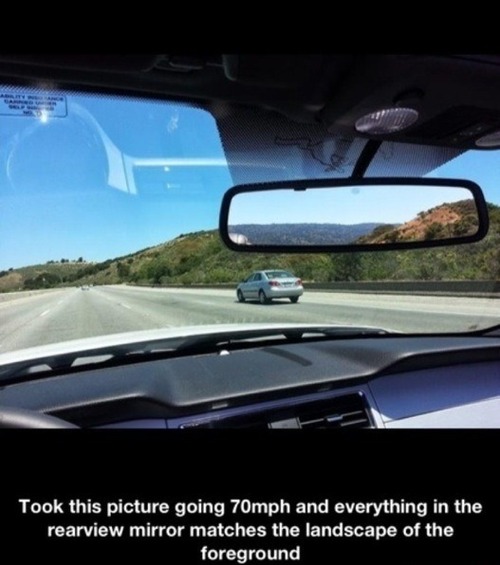 Took this picture going 70mph and everything in the rearview mirror matches the landscape of the foreground 